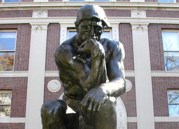 Statue on campus of man thinking