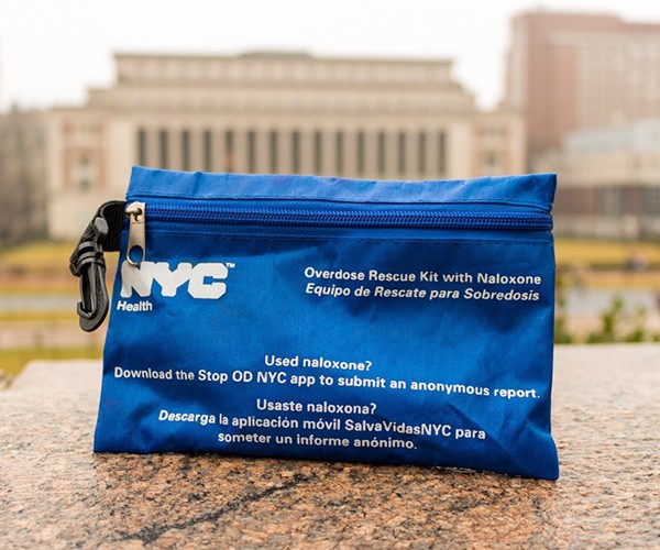 A small blue bag containing a naloxone rescue kit