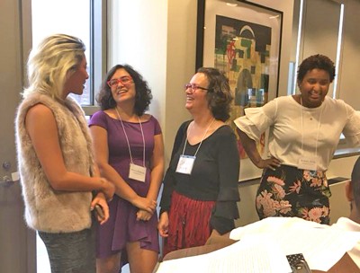 Four women gather to meet at a Fellows Program