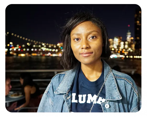 Anshera wears a navy Columbia tshirt and a denism jacket. 