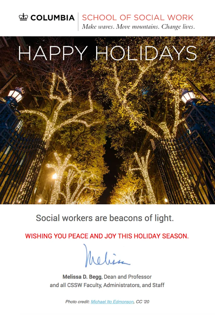 Evening holiday lights at the Columbia University gates 